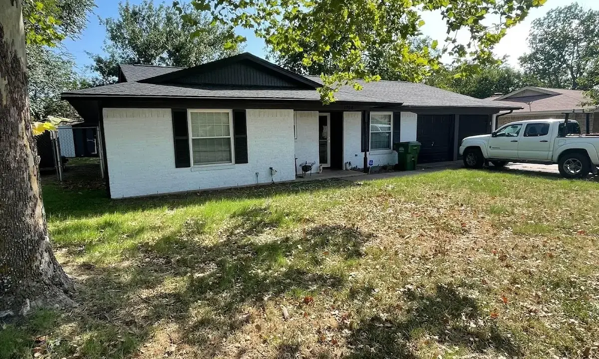 Professional roofing crew working on a residential roof in Mounds View